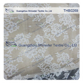 I fiori innumerevoli 3*1.5m graduano il tessuto secondo la misura del pizzo di chantilly del nylon di 100% per il vestito da sposa fornitore