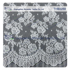I fiori innumerevoli 3*1.5m graduano il tessuto secondo la misura del pizzo di chantilly del nylon di 100% per il vestito da sposa fornitore
