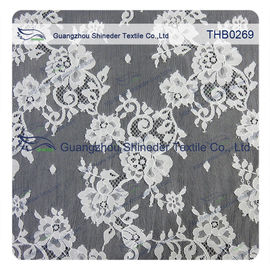 I fiori innumerevoli 3*1.5m graduano il tessuto secondo la misura del pizzo di chantilly del nylon di 100% per il vestito da sposa fornitore